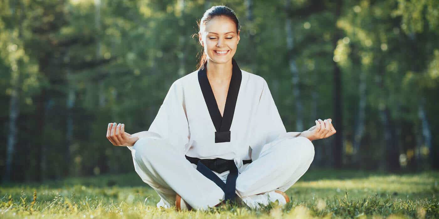 Martial Arts Lessons for Adults in Zephyrhills FL - Happy Woman Meditated Sitting Background